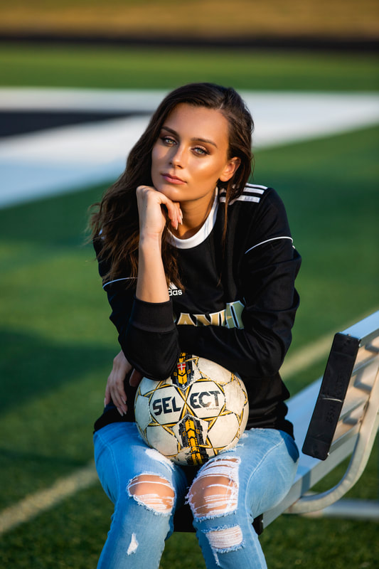 Senior girl showcasing her being a soccer player